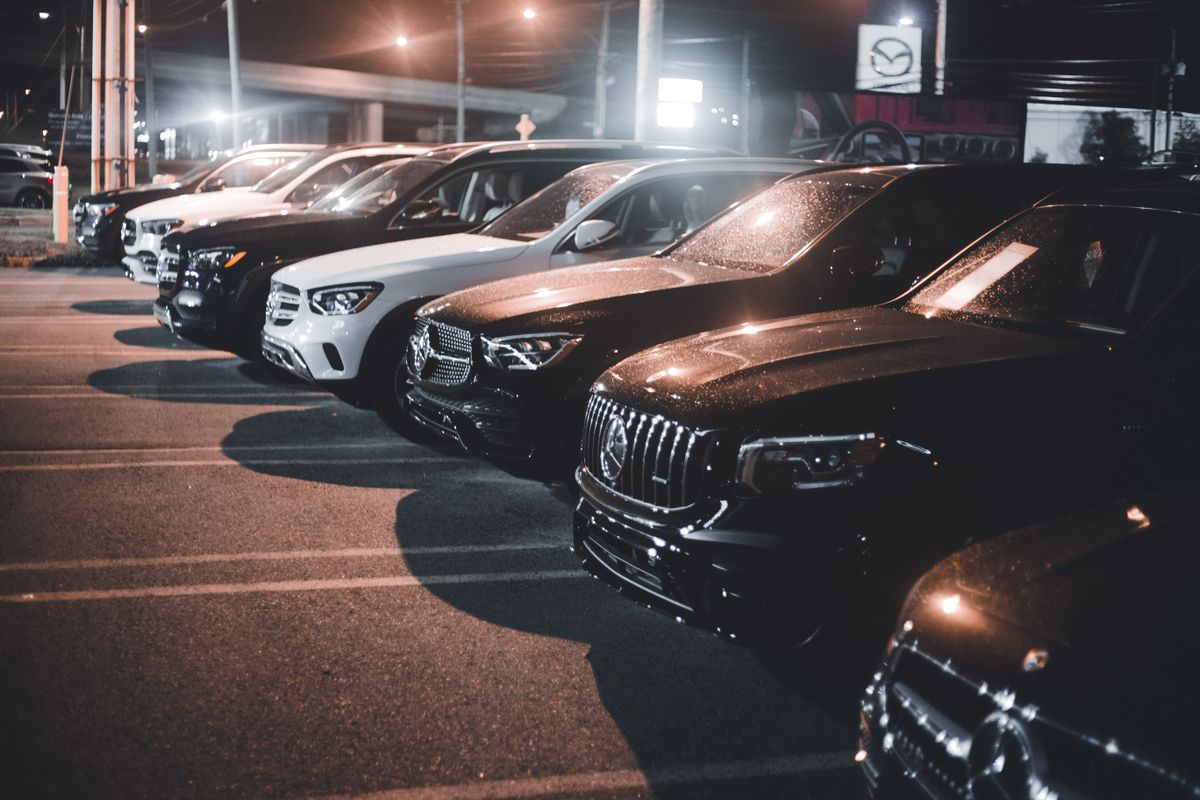 A line-up of premium and luxury rental vehicles parked side by side