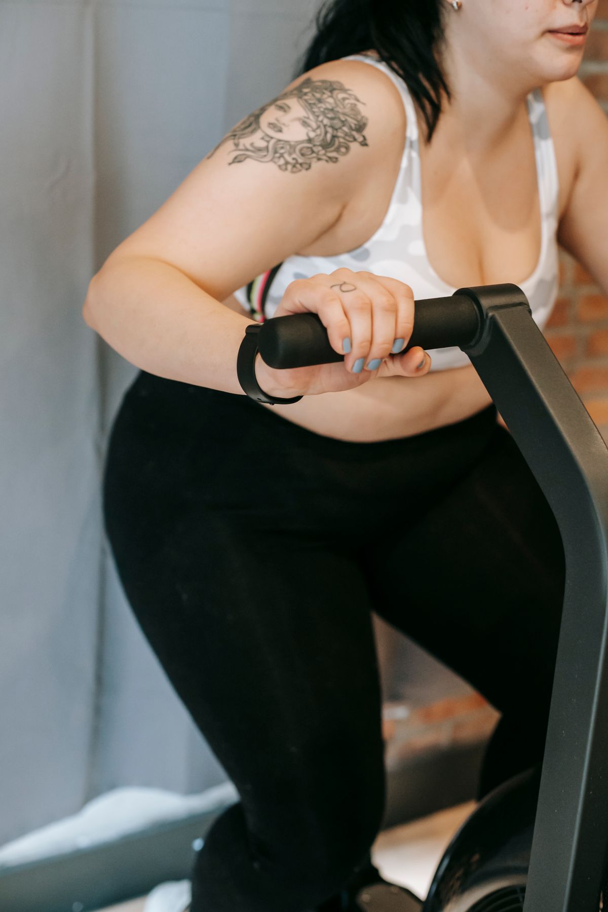 Studio member using resistance equipment during a personal training session