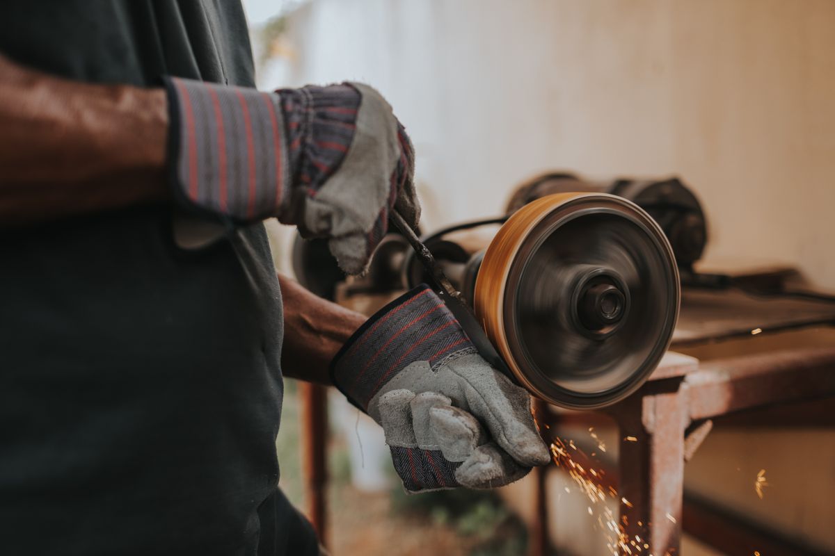 Handyman holding a power drill ready to start a home repair task
