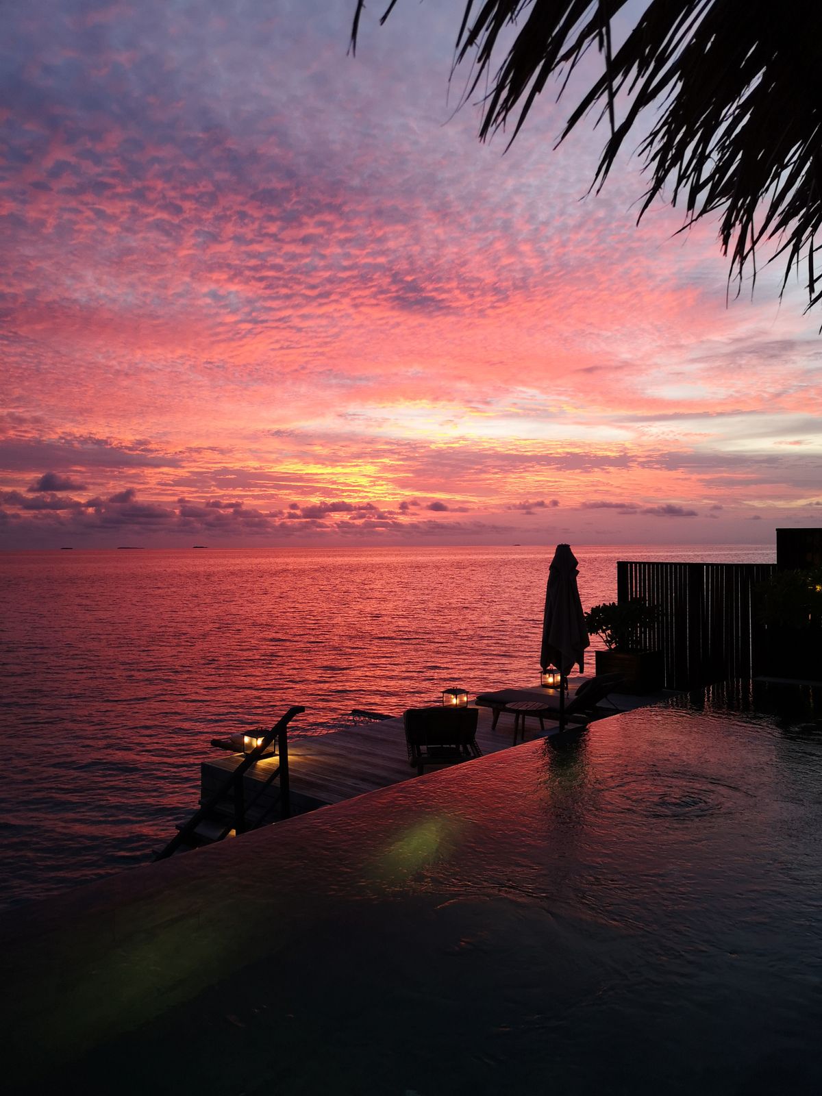Hotel pool and outdoor leisure area at sunset, a popular search and booking driver