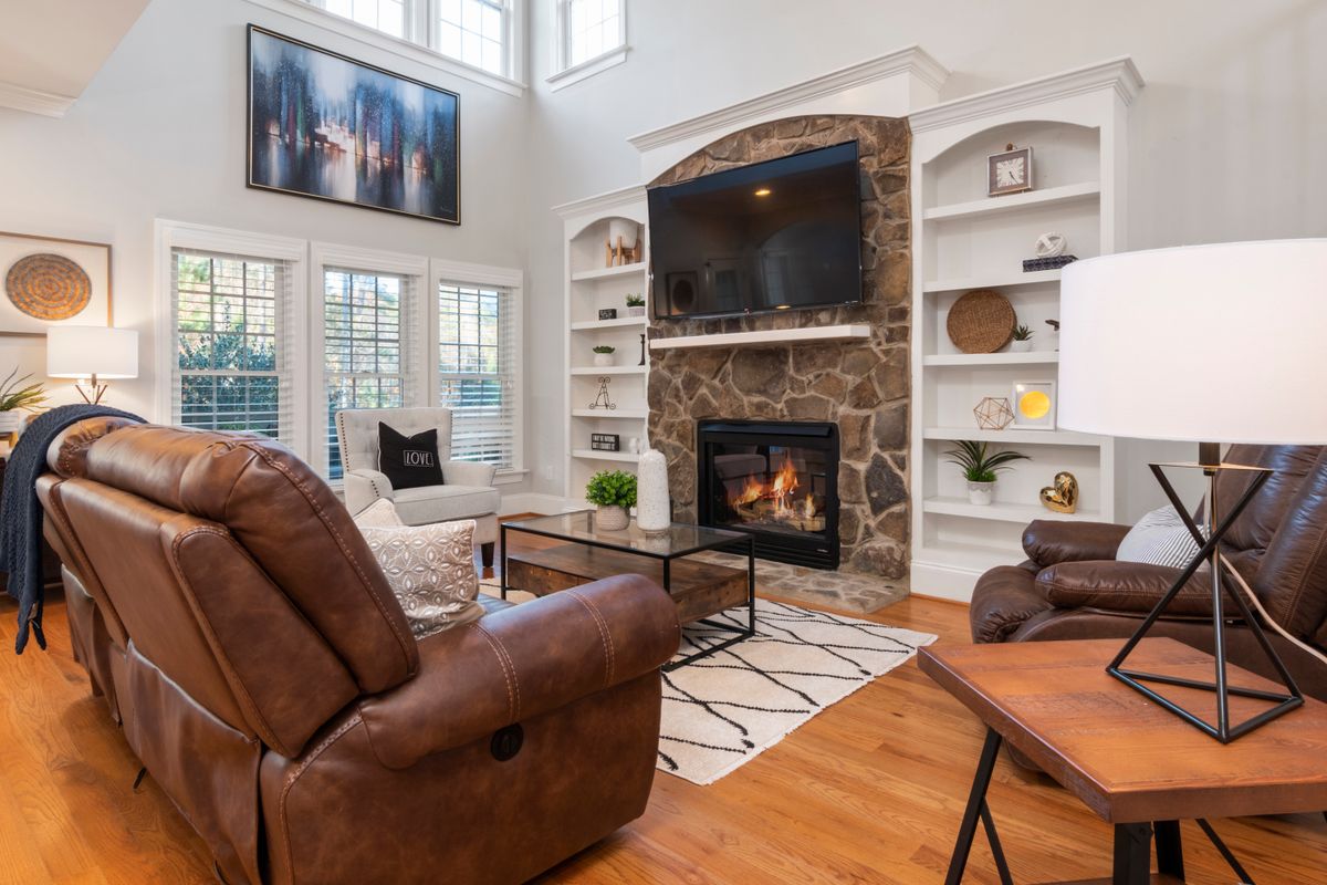 Cozy living room interior with fireplace styled by a professional interior designer