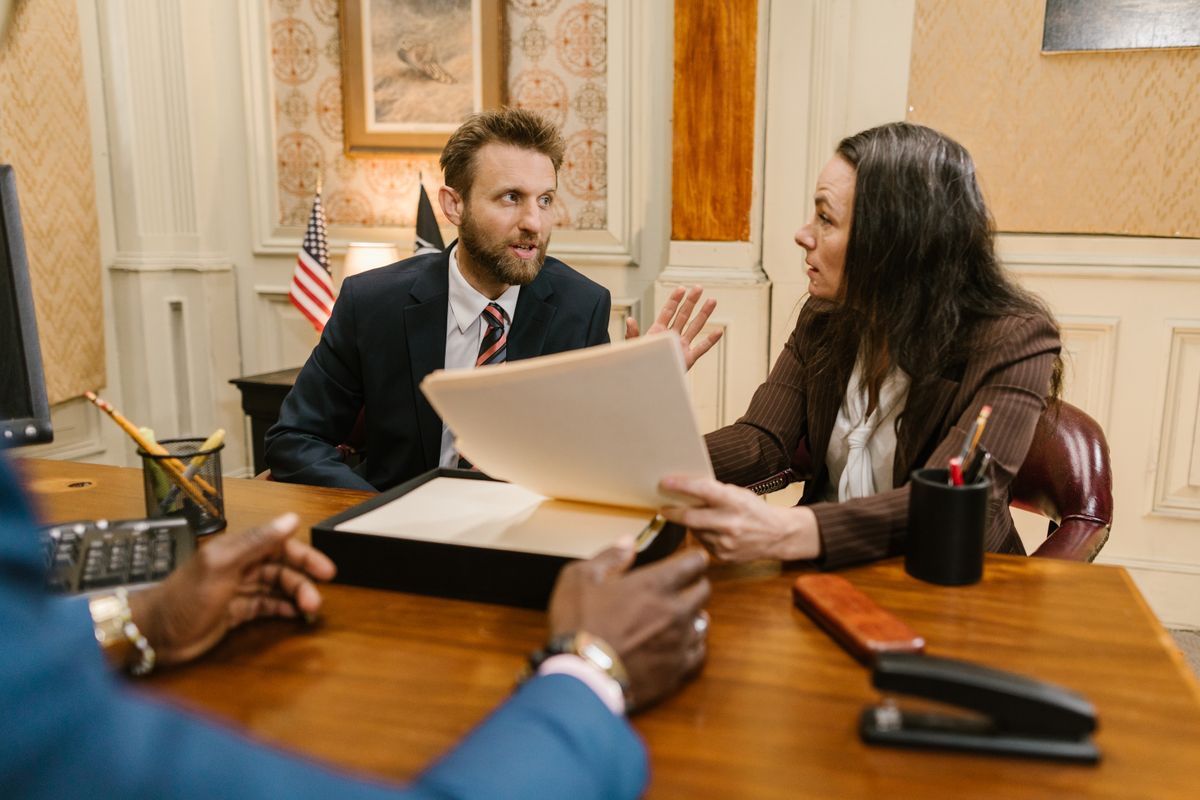 Lawyer discussing a case with a client during a consultation