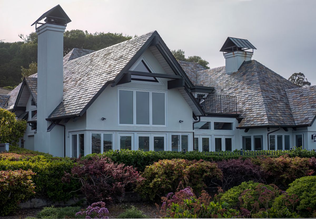 Luxury mansion with landscaped garden and elegant architectural facade