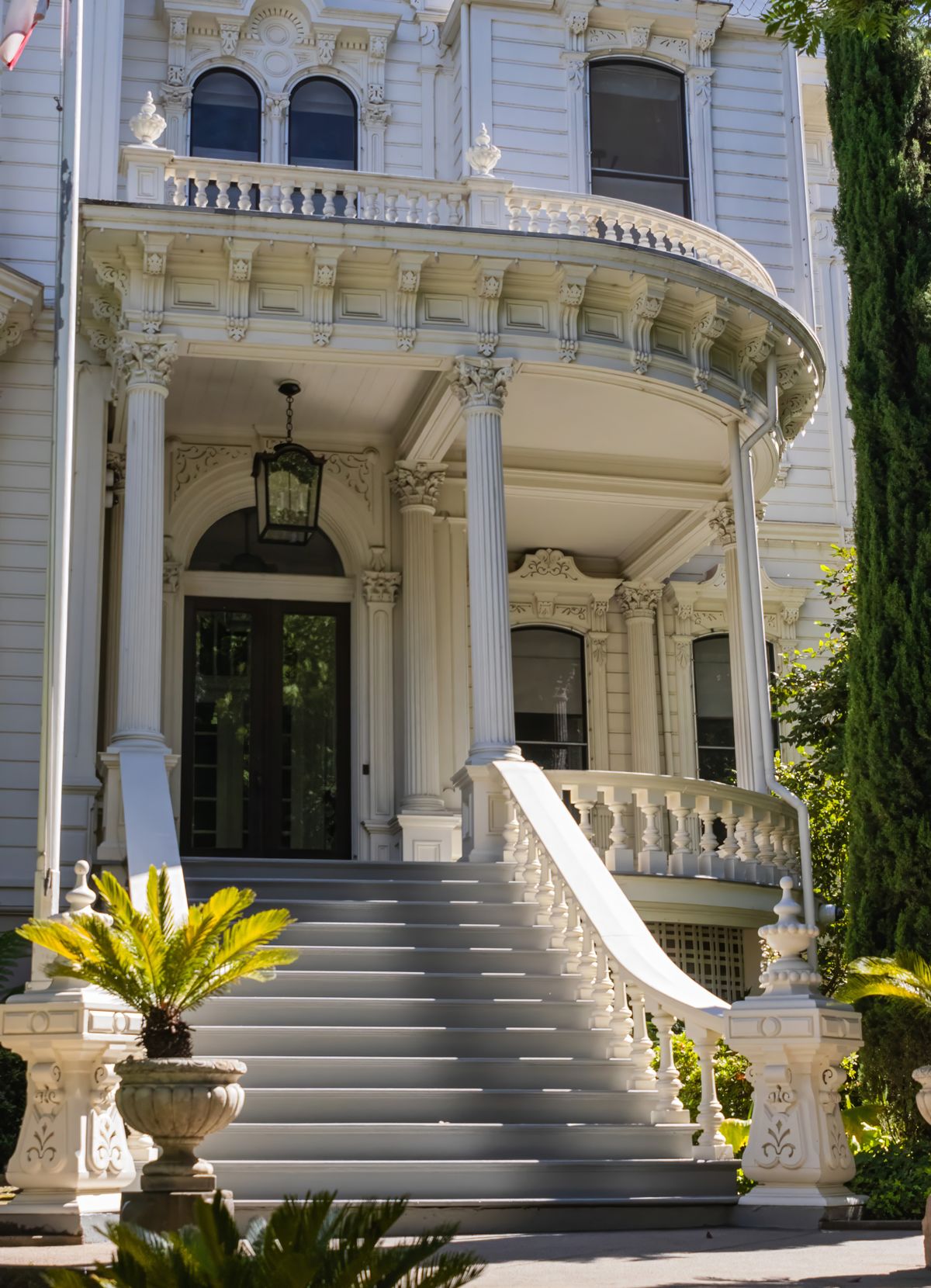 Sweeping staircase inside a classic luxury mansion interior