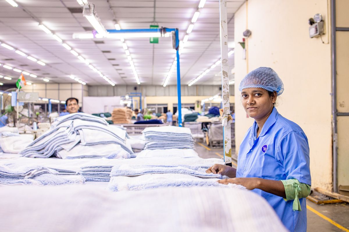 Factory workers on a manufacturing production line