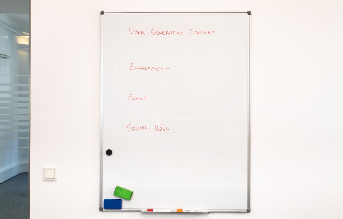 Marketing agency colleagues collaborating at a shared desk on brand and content planning