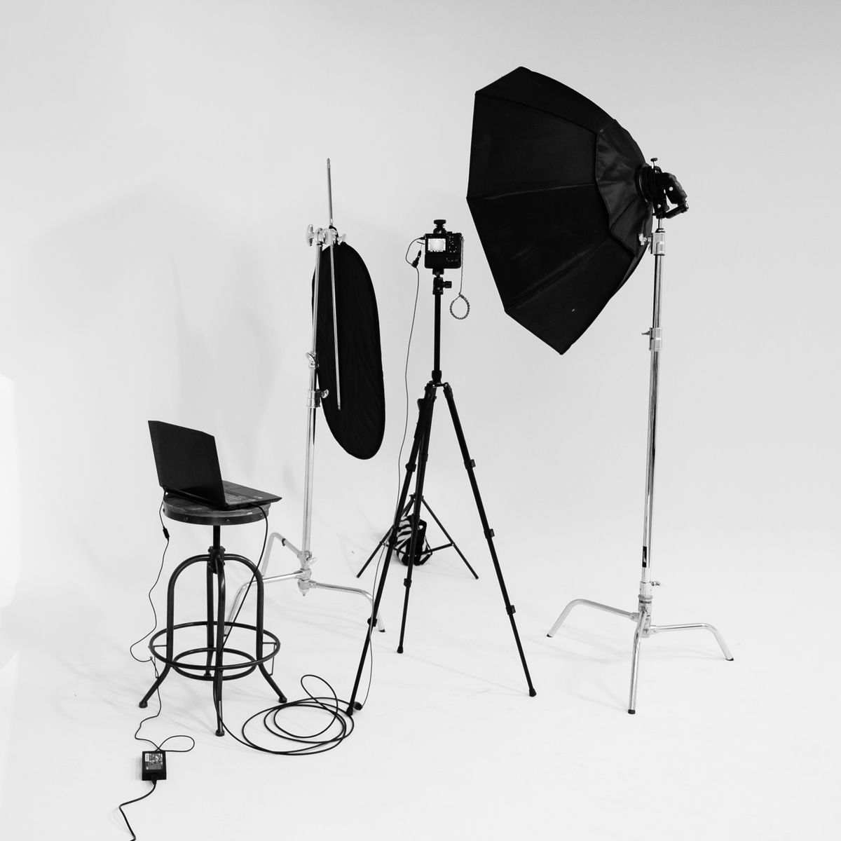 Black and white photography studio with lighting equipment