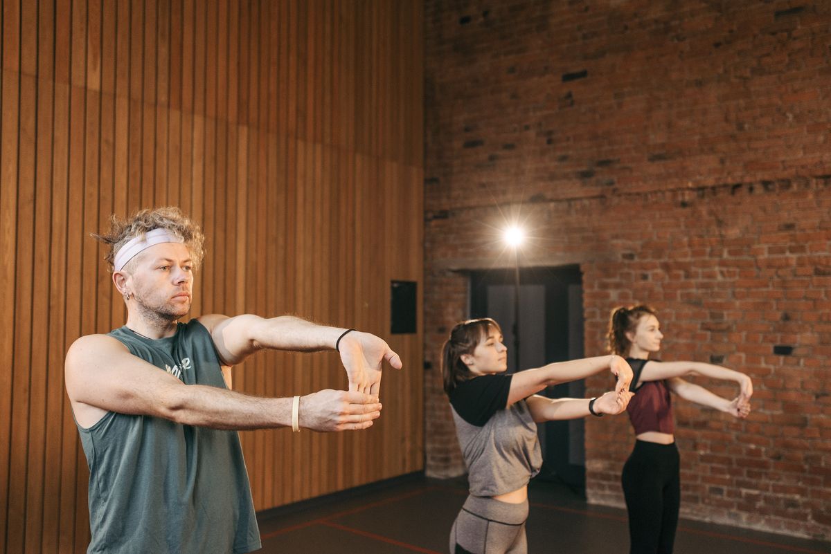 Patients stretching during a group physiotherapy and mobility session