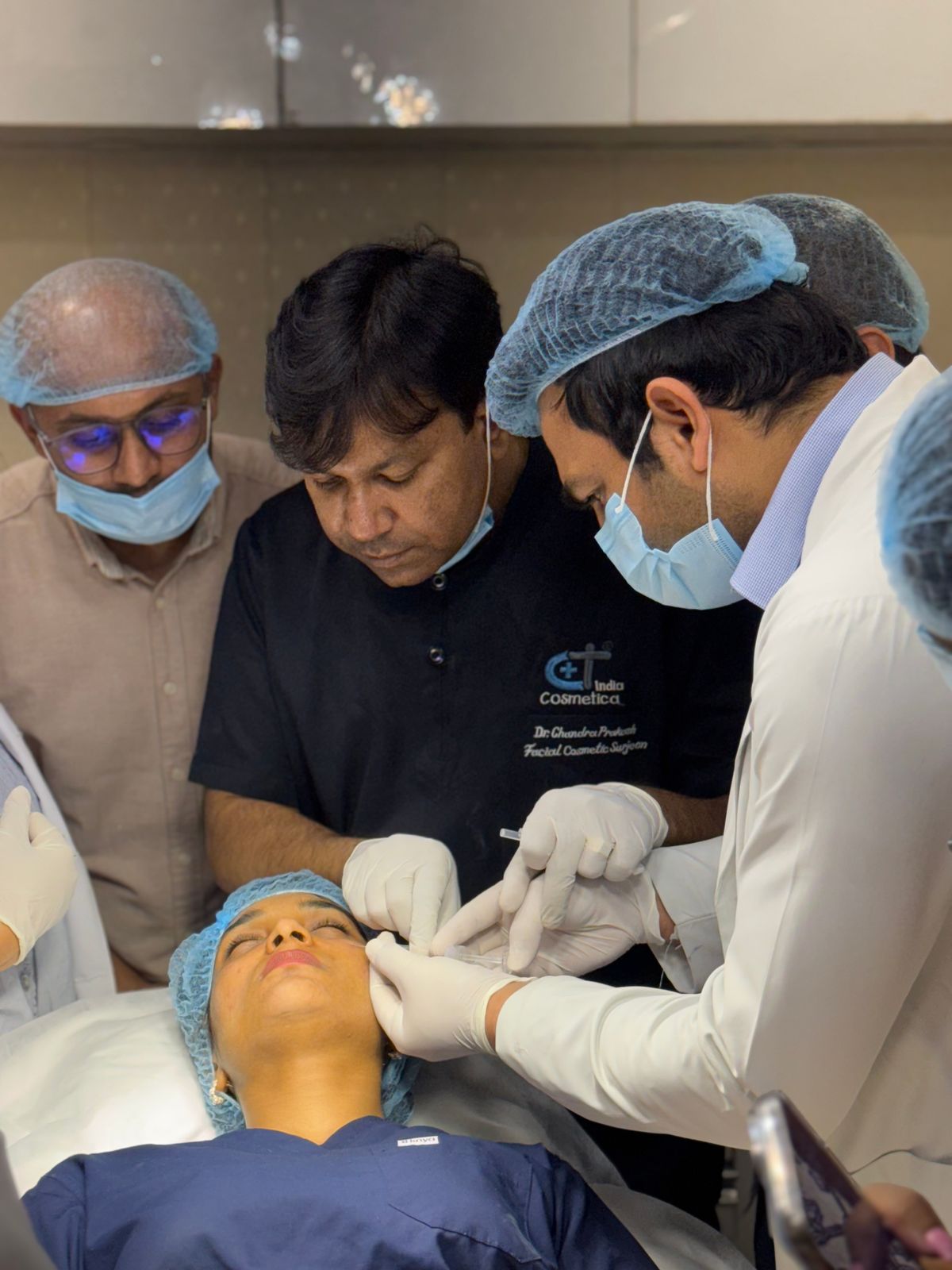 Surgeon and clinical team performing a precision cosmetic treatment procedure in a modern Edinburgh clinic