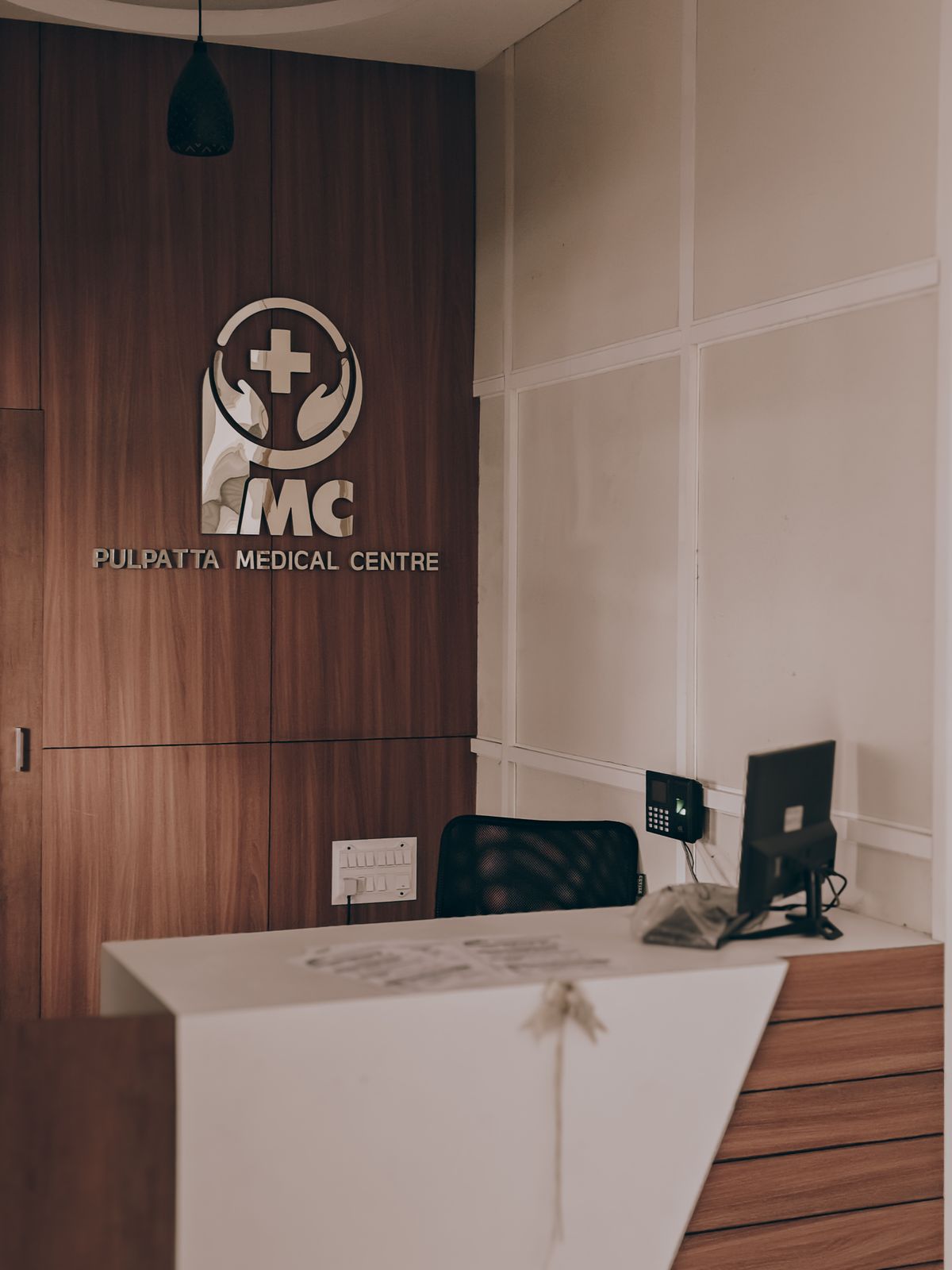 Bright, modern medical reception area typical of a private plastic surgery clinic