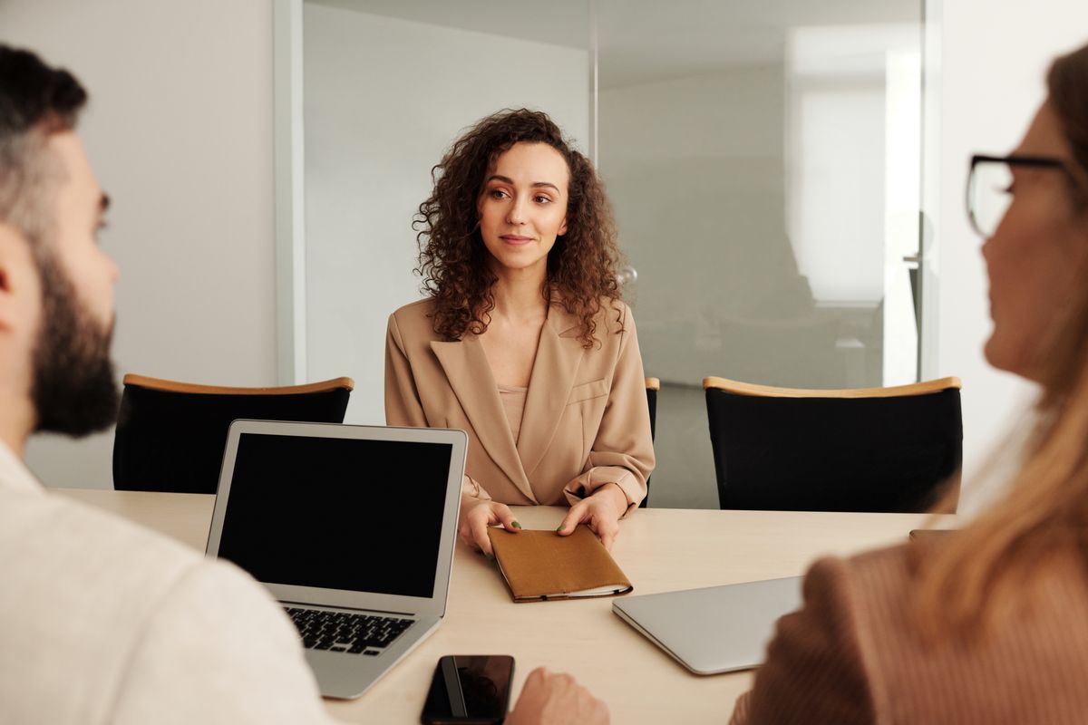 Woman in business attire attending a professional job interview