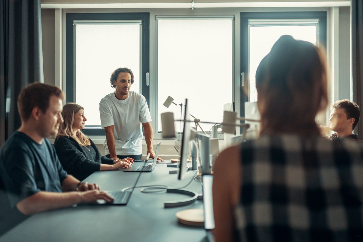 Recruitment team collaborating around a table in a modern office