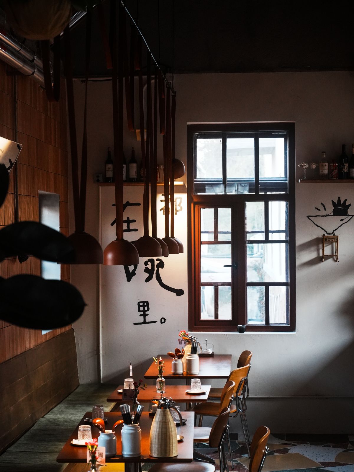 Modern Edinburgh restaurant dining room with warm ambient lighting and set tables