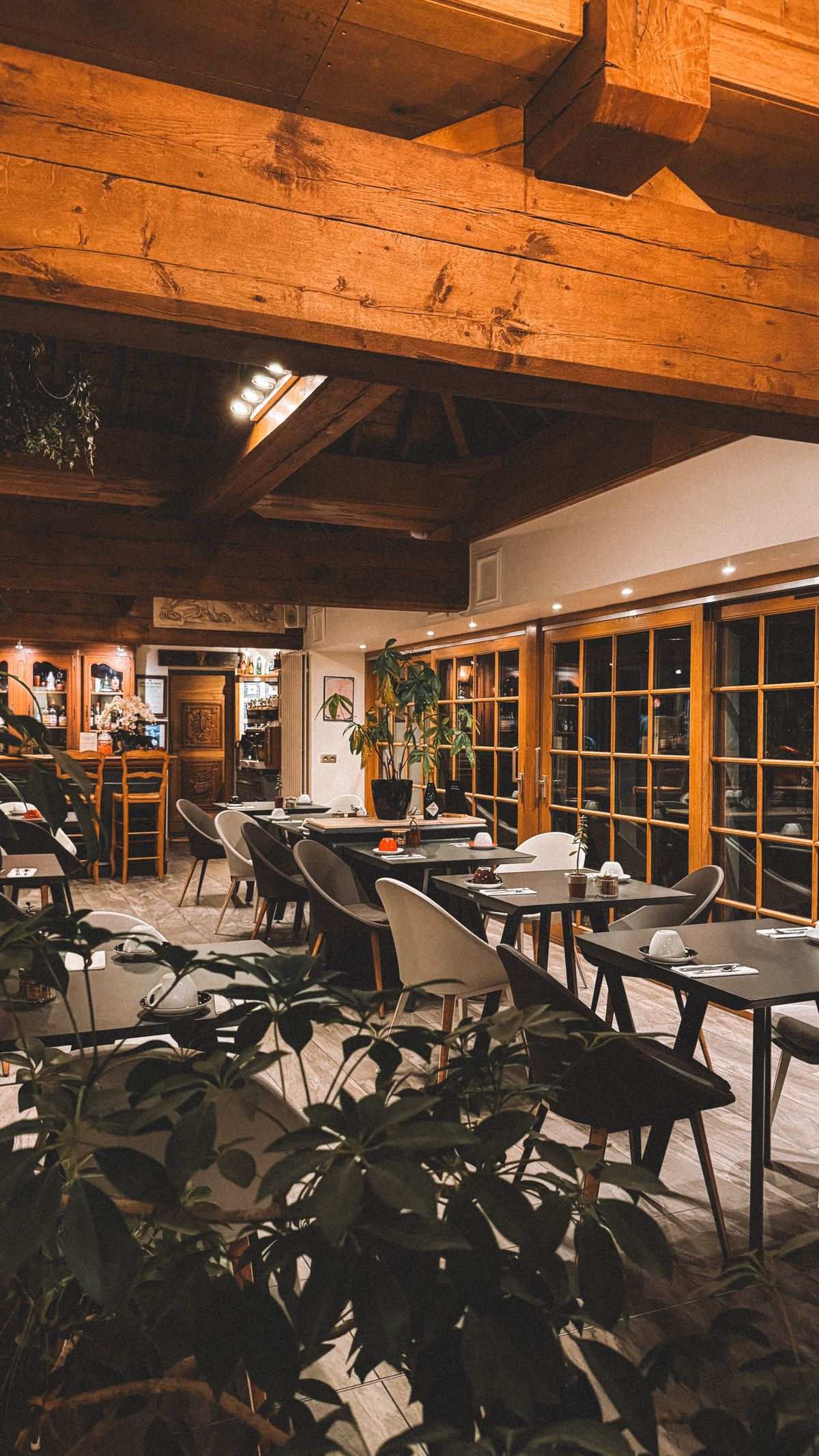 Cosy rustic restaurant interior with exposed wooden beams and intimate seating