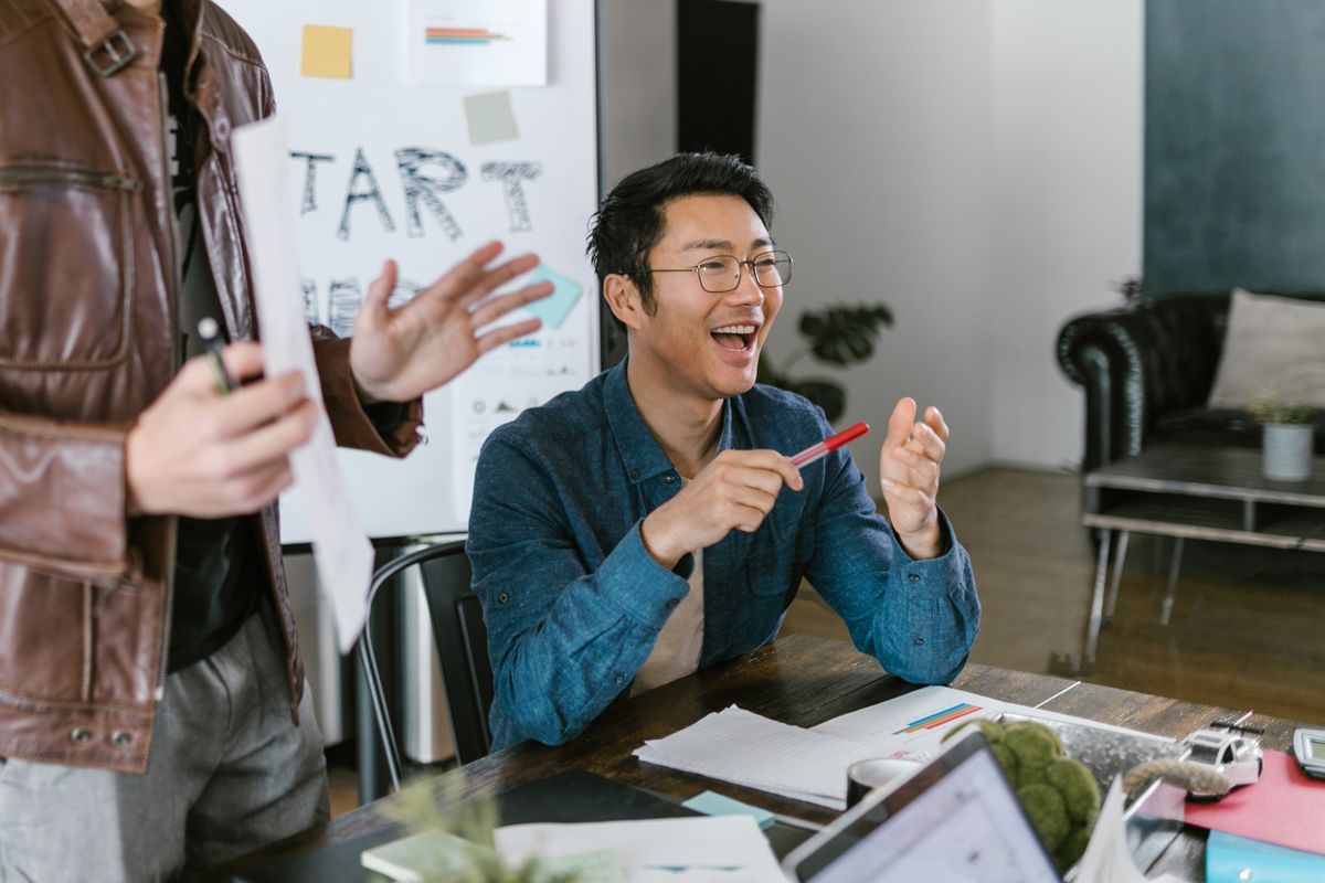 Founders discussing fundraising and go-to-market strategy in a modern office