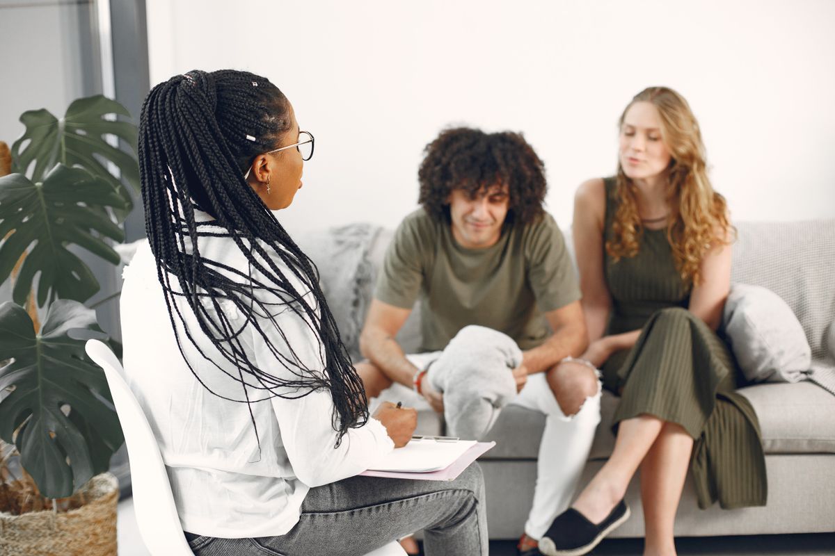 Couple sitting together during a therapy session with their counsellor in Edinburgh