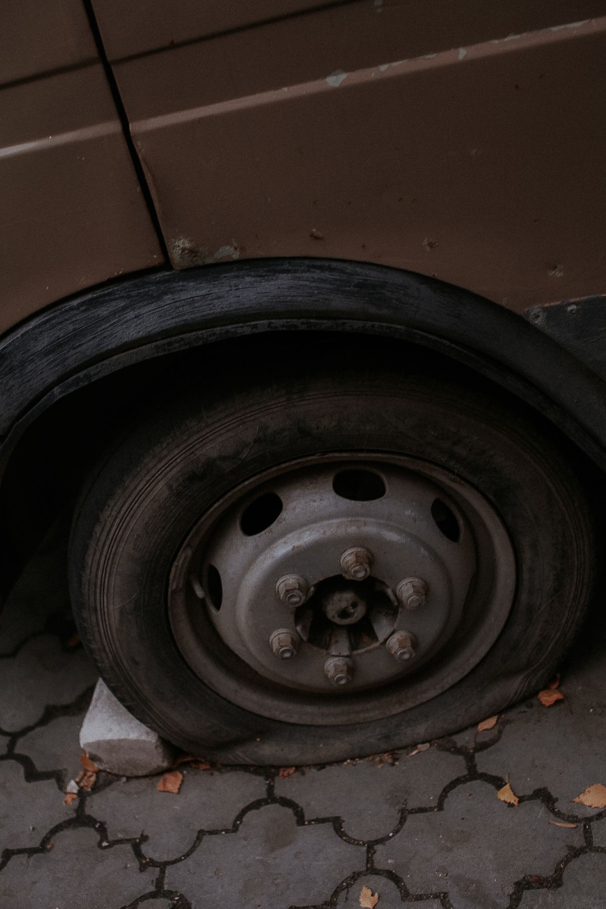 Close-up of a worn flat tyre in need of replacement